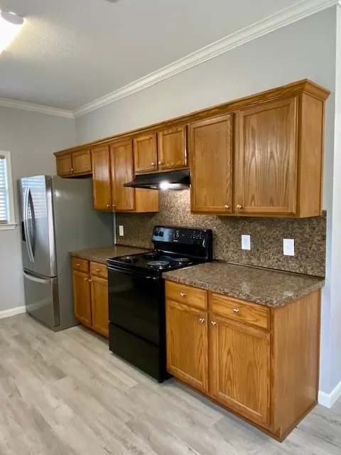 Cabinets with range and refrigerator