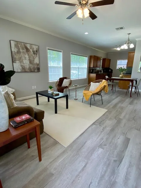 Living area with dining area and kitchen in background