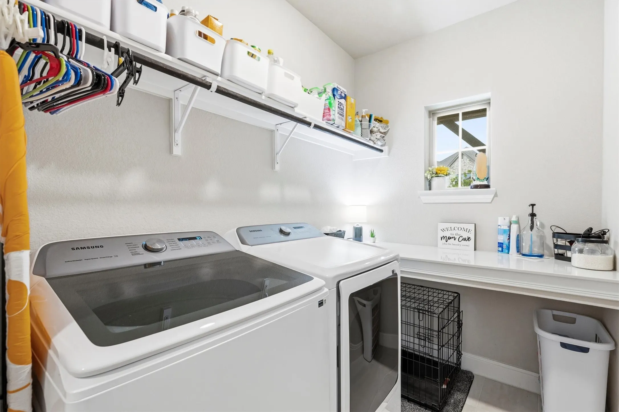 Large walk-in laundry room with folding counter