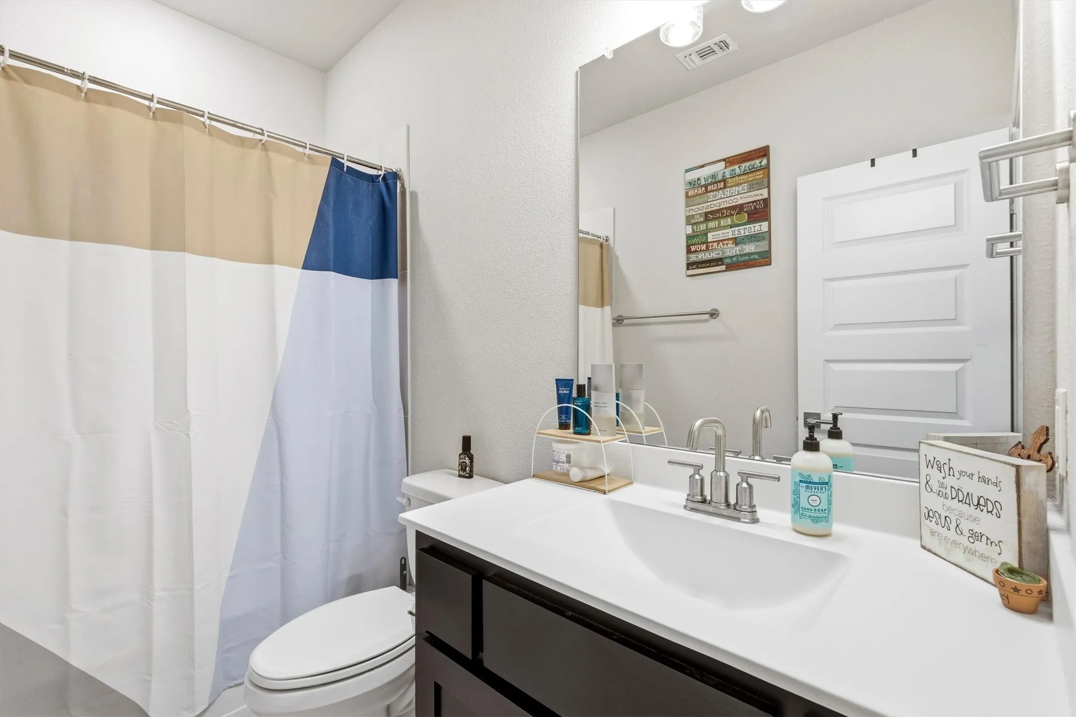Bathroom 2 on the first floor has a tub shower combination