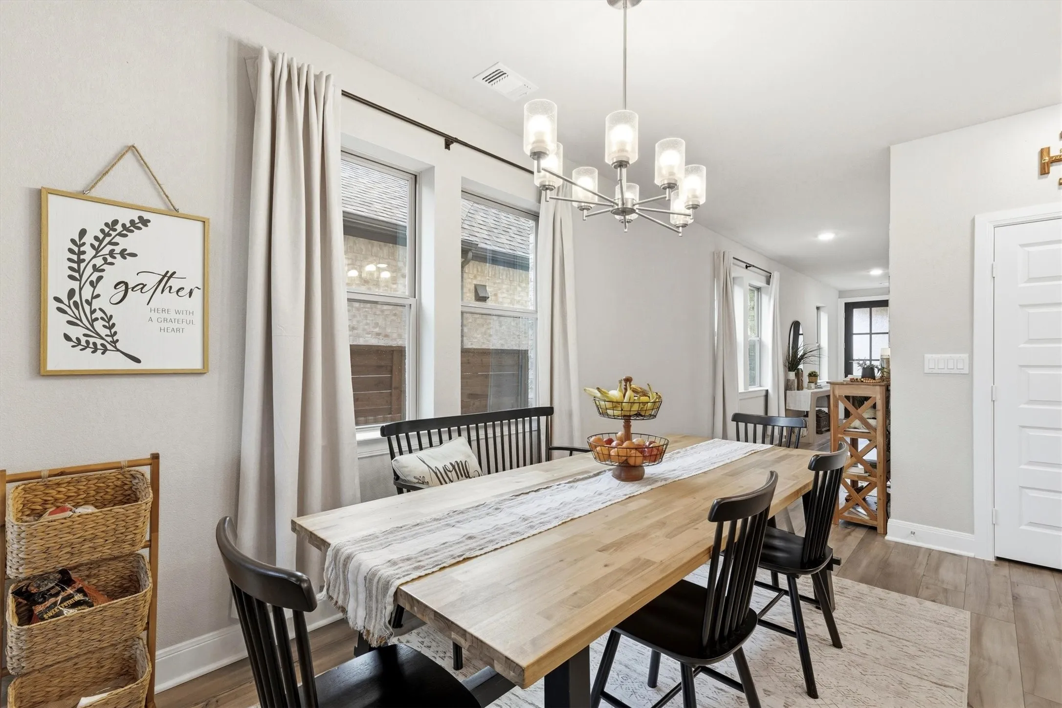 This dining area is adjacent to the kitchen with space for a large table