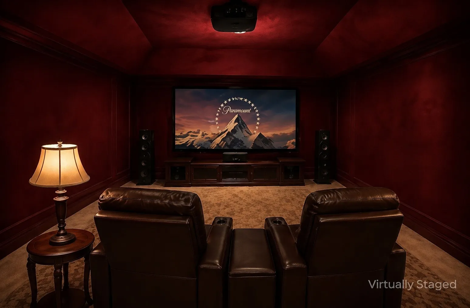 Dedicated media room featuring a projection screen, dark wood trim, and a high-pile carpet
