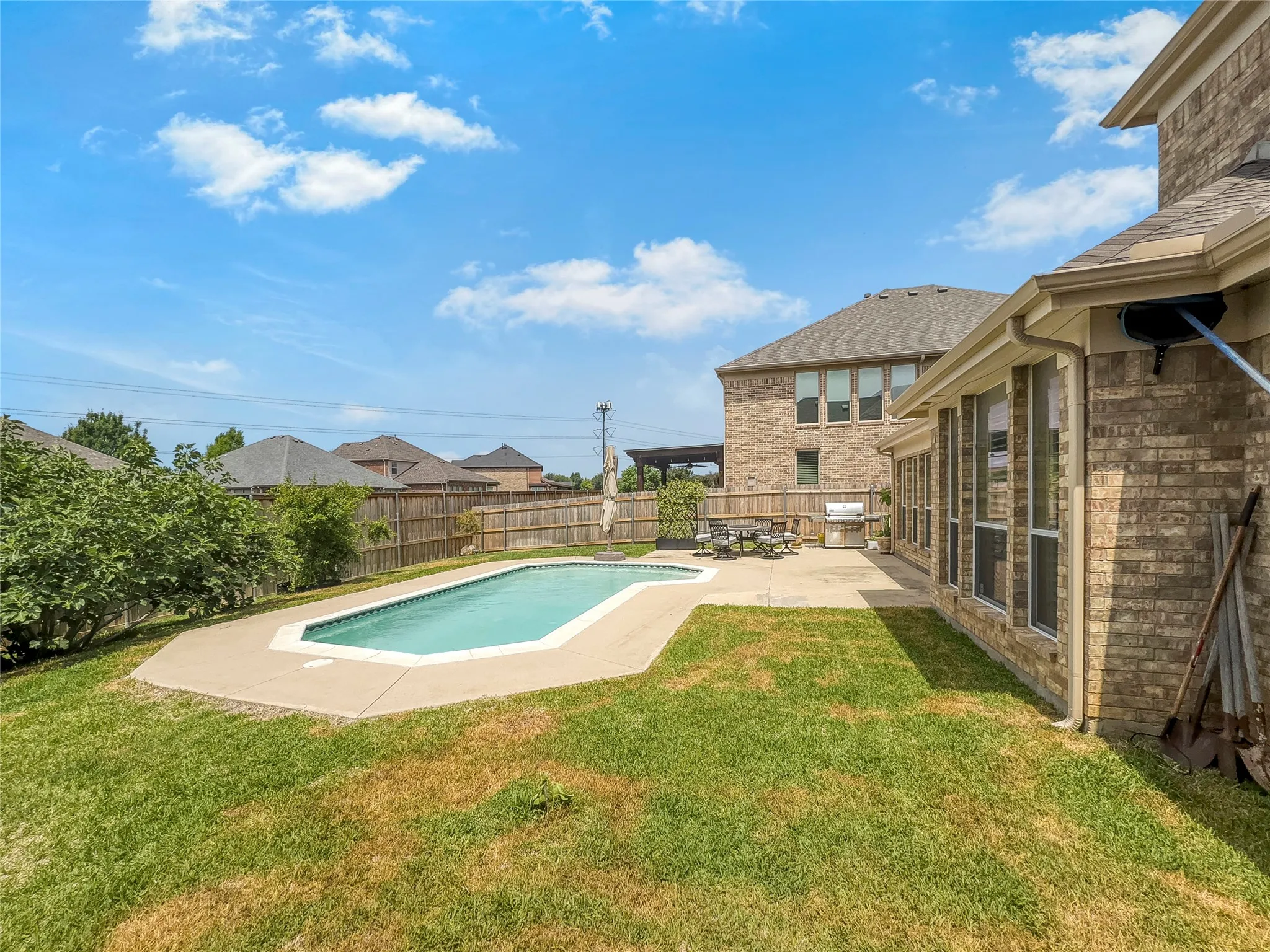 Backyard is large and has plenty of room to entertain