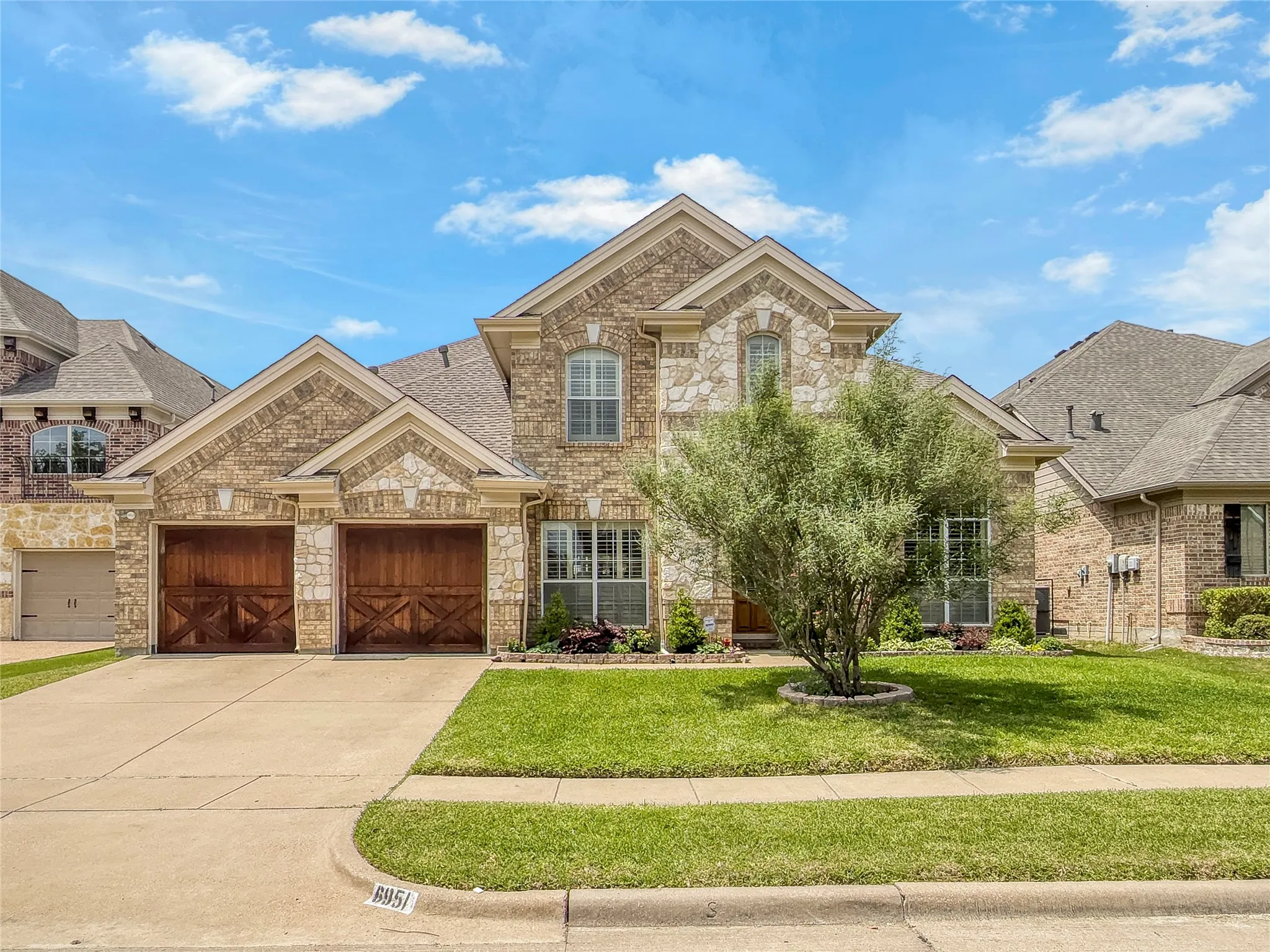 Cedar garage doors, sprinkler system, well maintained