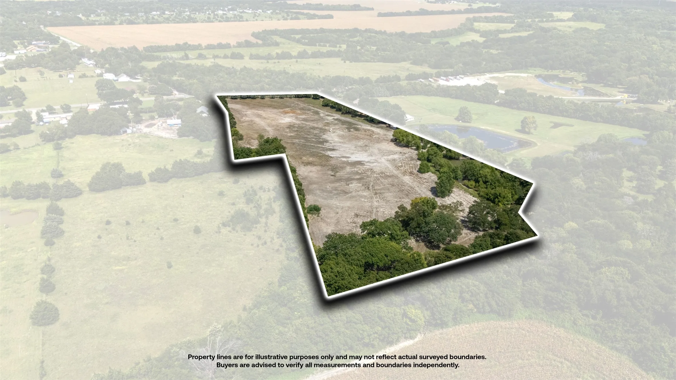 Expansive undeveloped land featuring a mix of cleared areas and mature tree coverage