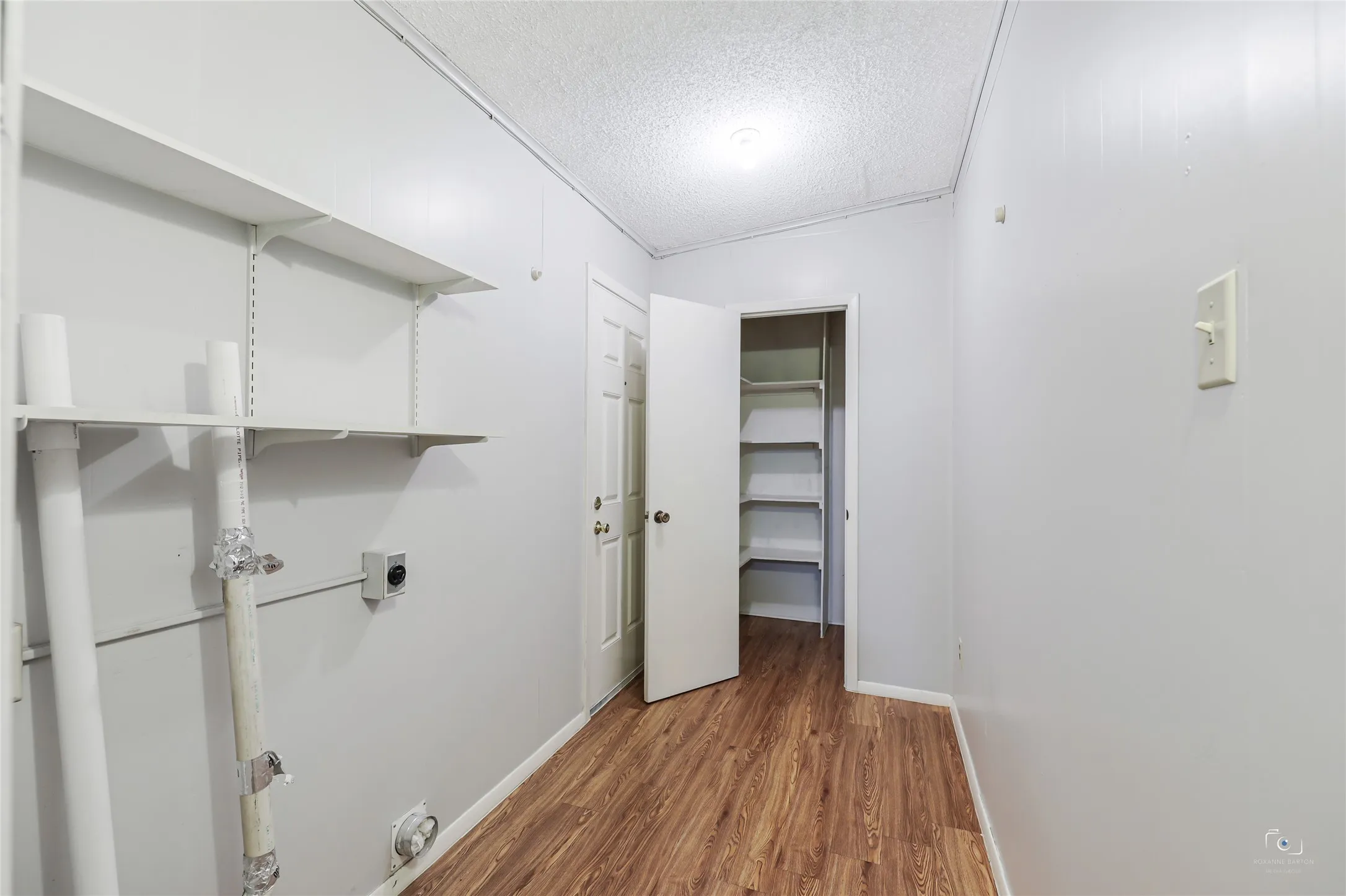 Laundry room or mud area from the backyard also offers a walk-in pantry or utility closet and more wall space for adding additional shelves, hooks, cubbies,....