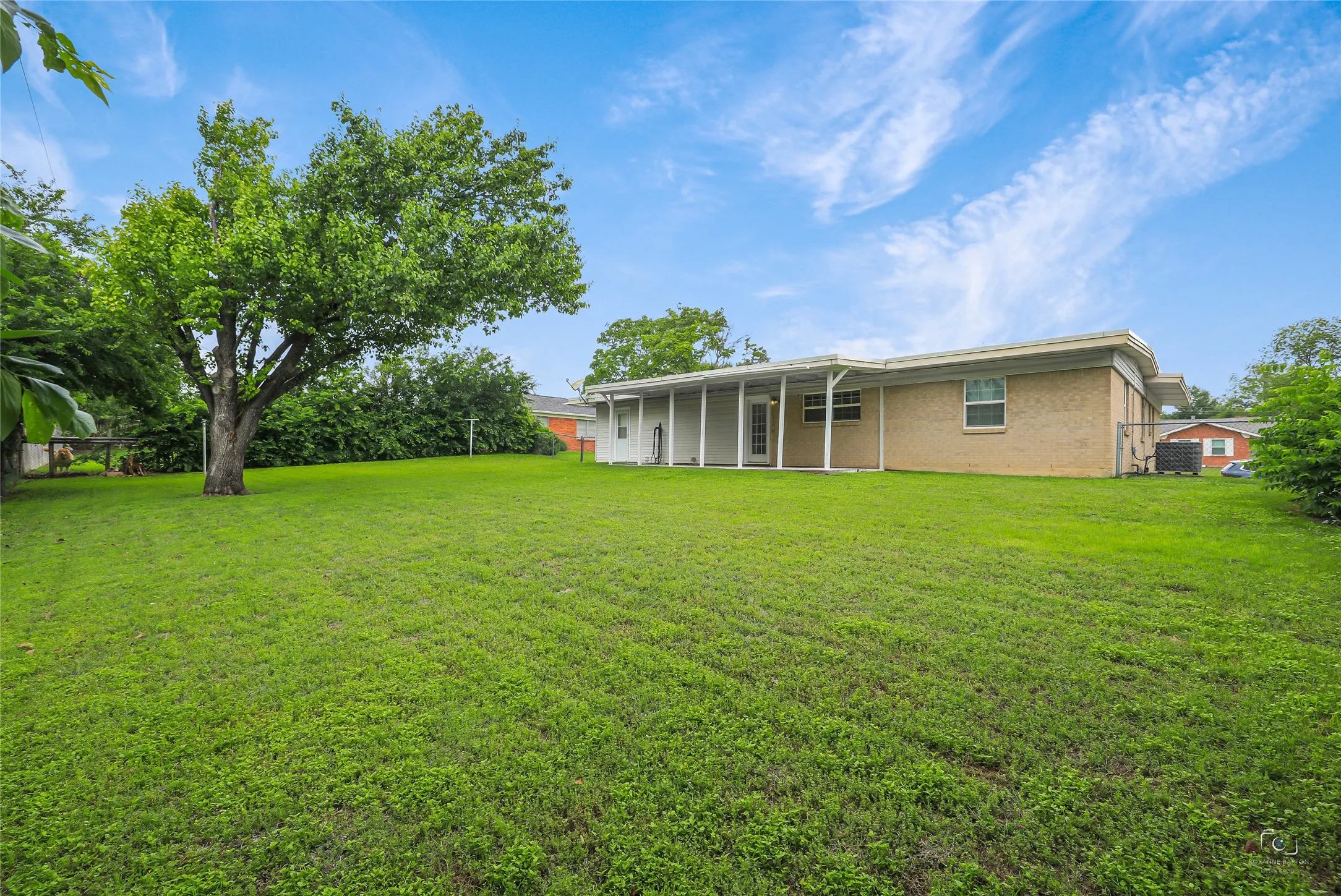 Views of the spaciou backyard and shows well!     Ideal for adding a pool, fruit trees, vegetable garden, outdoor kitchen etc....storage building.  No HOA!
