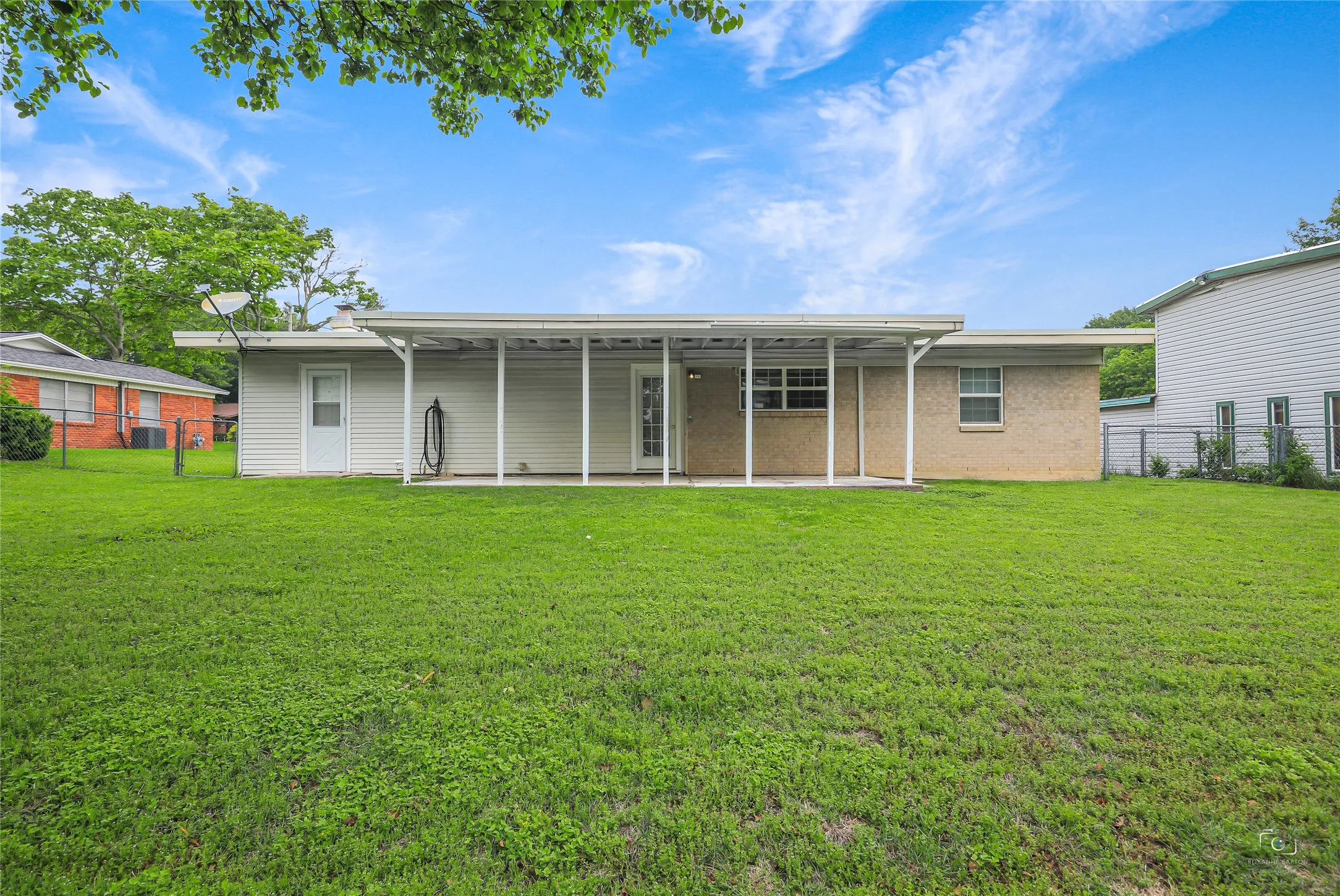 Easy to maintain brick and exterior siding with covered back patio that could easily be enclosed etc....lots of options and  two doors to access to mudroom-laundry and kitchen area  from backyard! Start planning and packin to make this your home or keep for an invetsment!  Shows well!