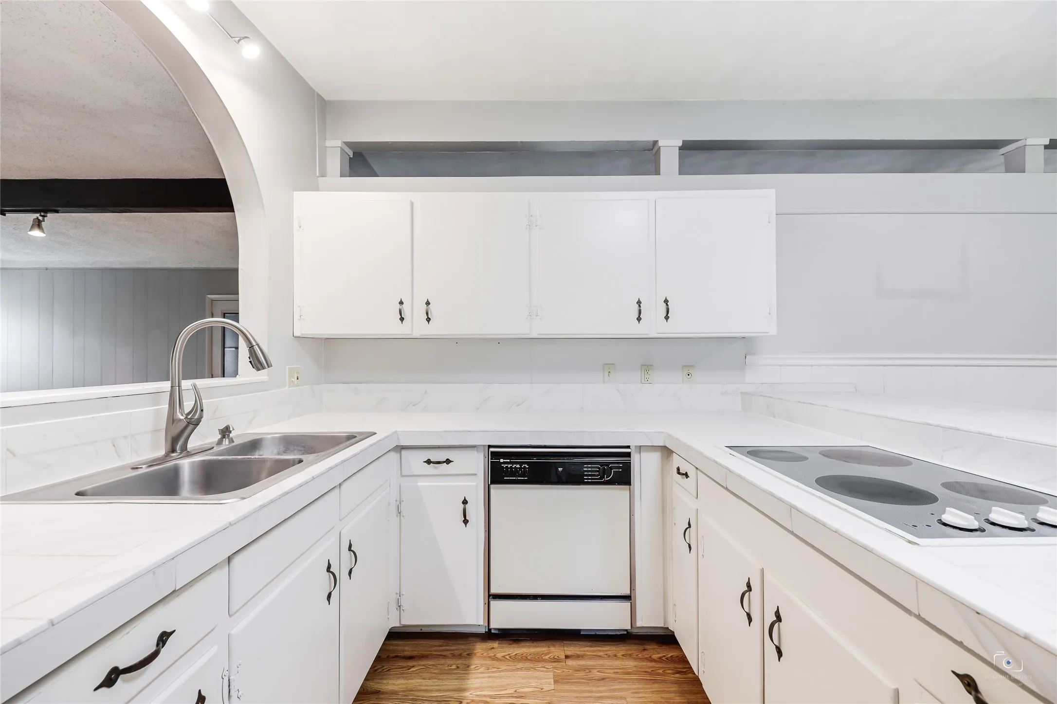 Light and bright kitchen with lots of cabinets and plenty of counterspace for those who like to cook and bake etc!  Shows well!