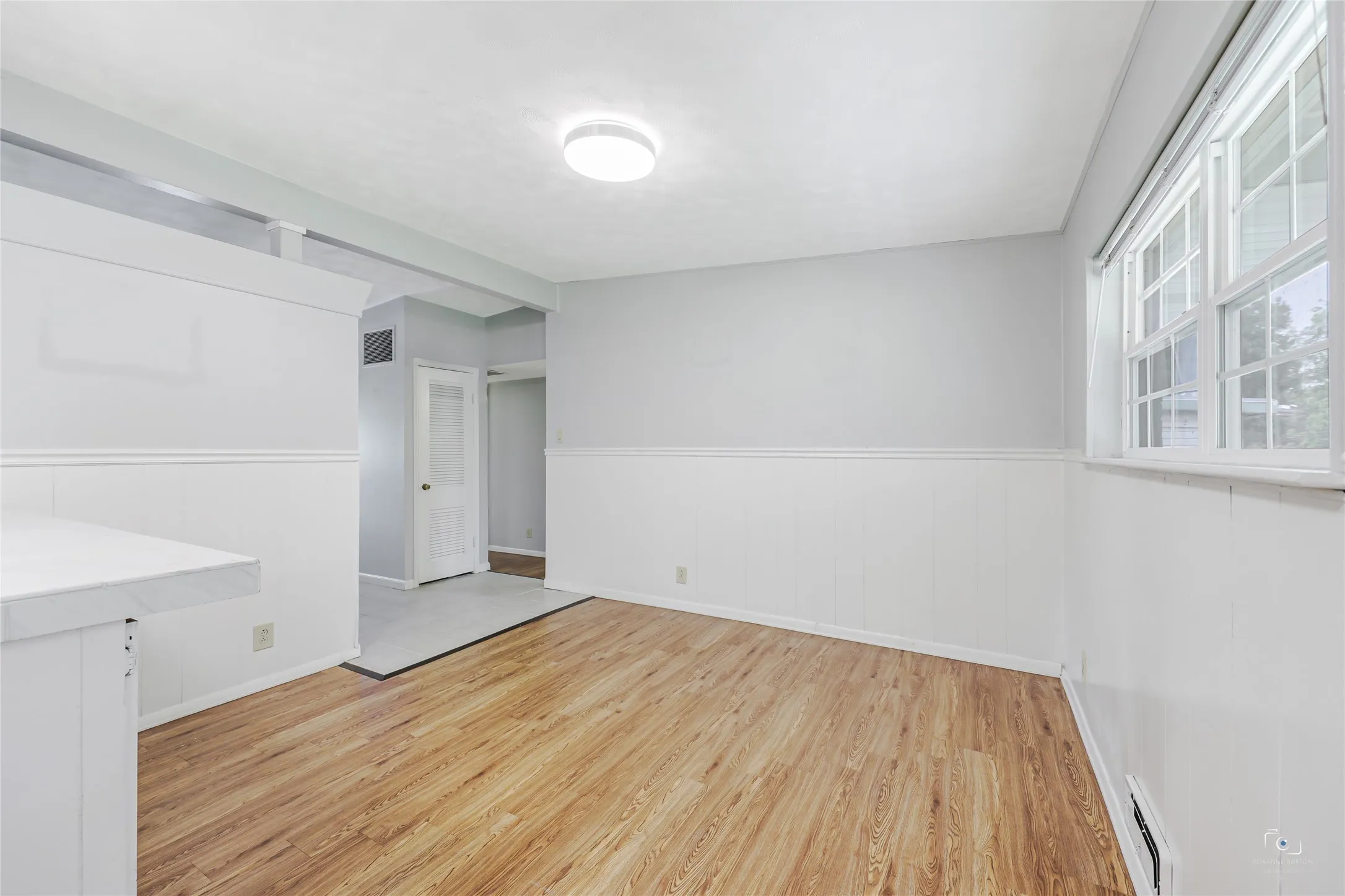 This is yoour dining breakast area that opens to your kitchen and note that visitors that are in your entry foyer area do not have views of your kitchen if preparing meals and want additional privacy rather than wide open space.   Easy access to the bedrooms as well as HVAC and Gas Water heater.  This home was refurbished appro 2015! Storm Doors 2012! Pella Windows 2011!