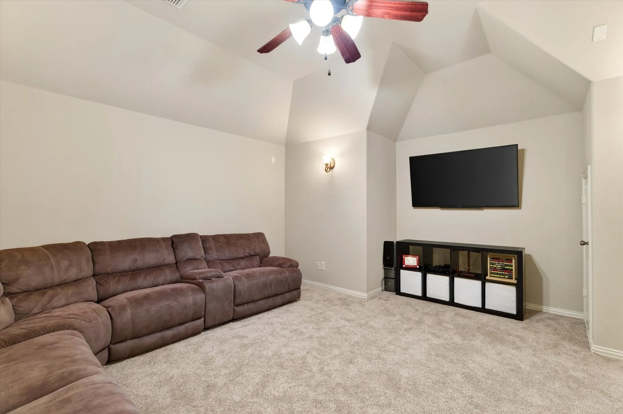 A dedicated media room with storage creates the perfect spot for movie nights, gaming, or watching football at a volume that says “priorities.”