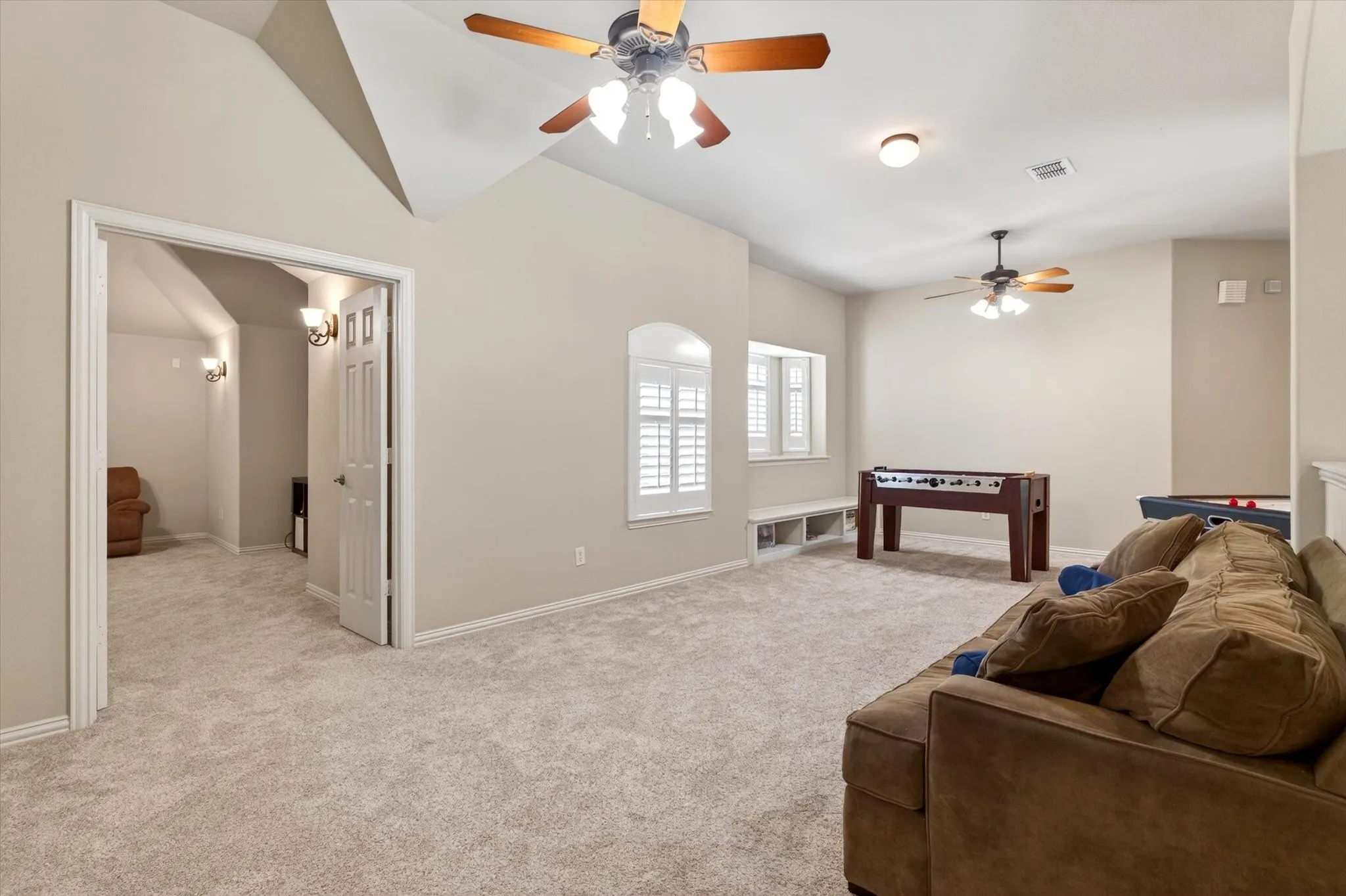 The massive upstairs game room gives everyone room to spread out, play, lounge, study, or claim a corner as their own.