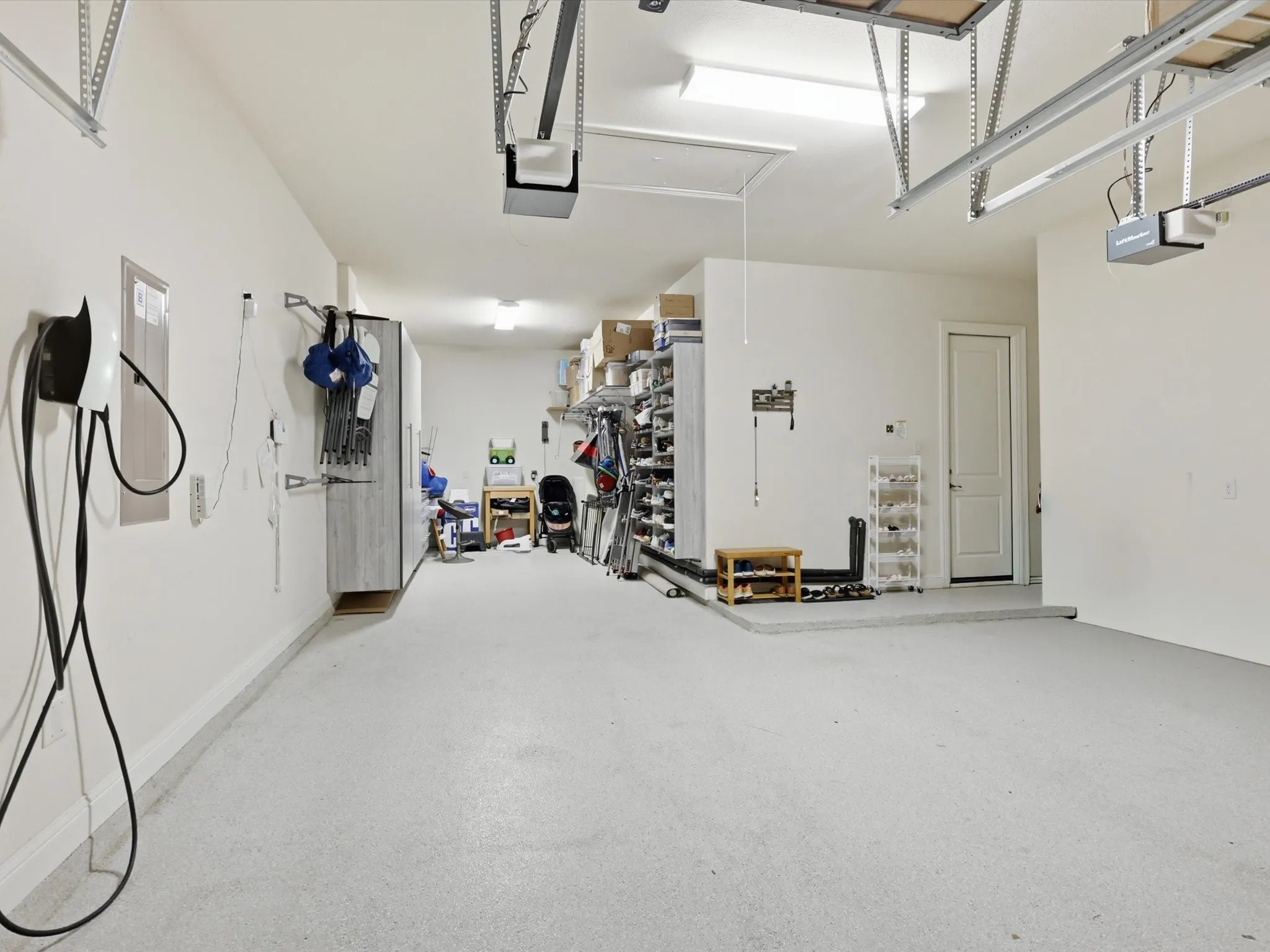 3 Car Garage w/ Custom Shelves & Electric Charging Station