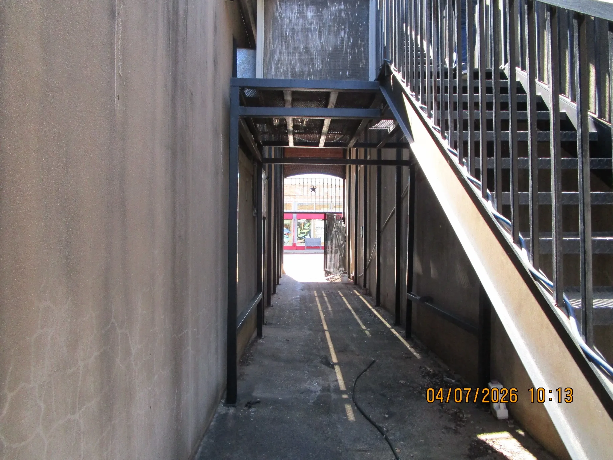 breezeway with steps to balcony
