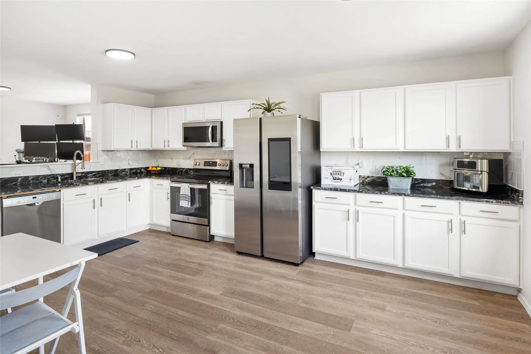 This high-end Samsung refrigerator with screen comes with this home....