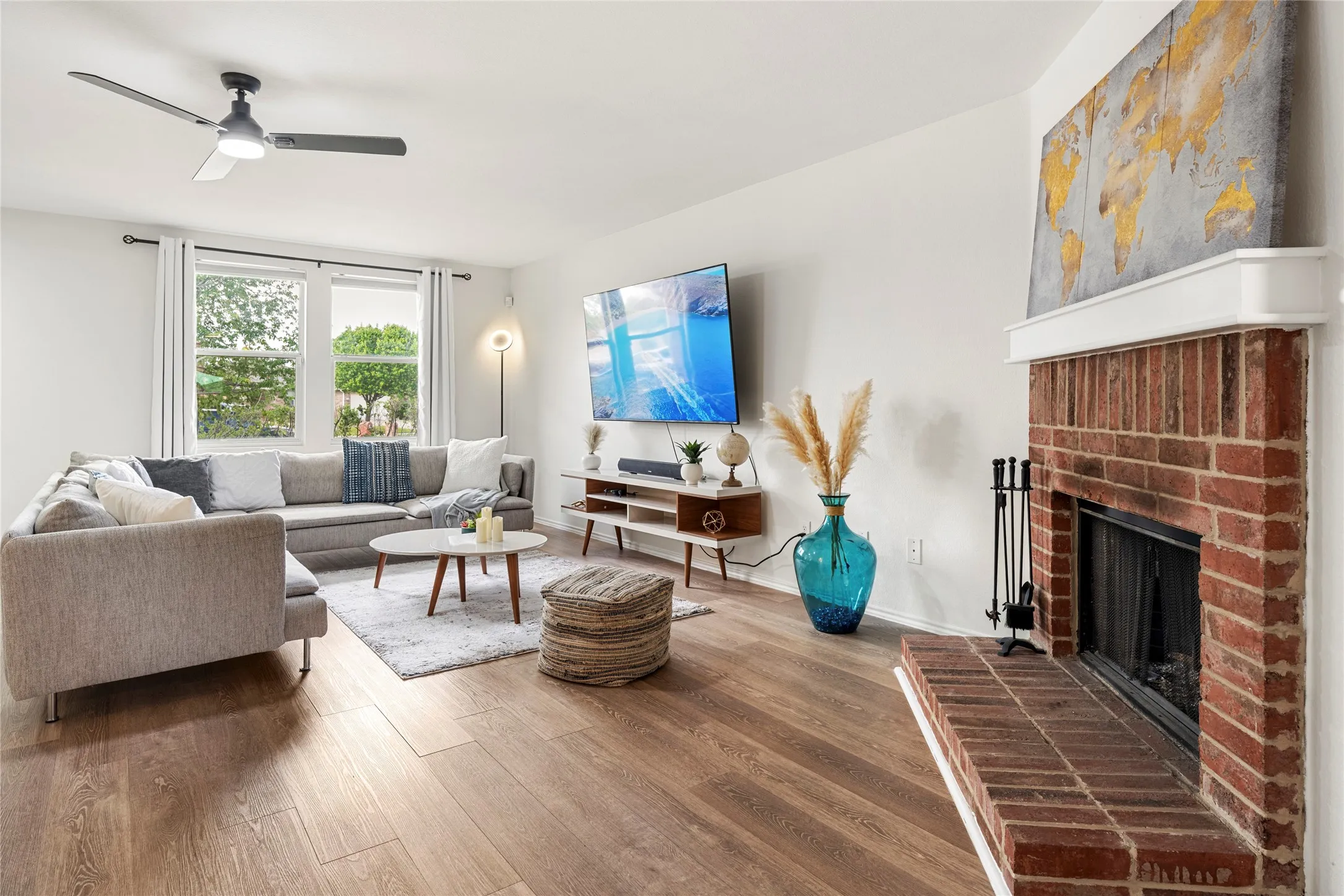 Lovely light laminate flooring and lots of light in this living room....