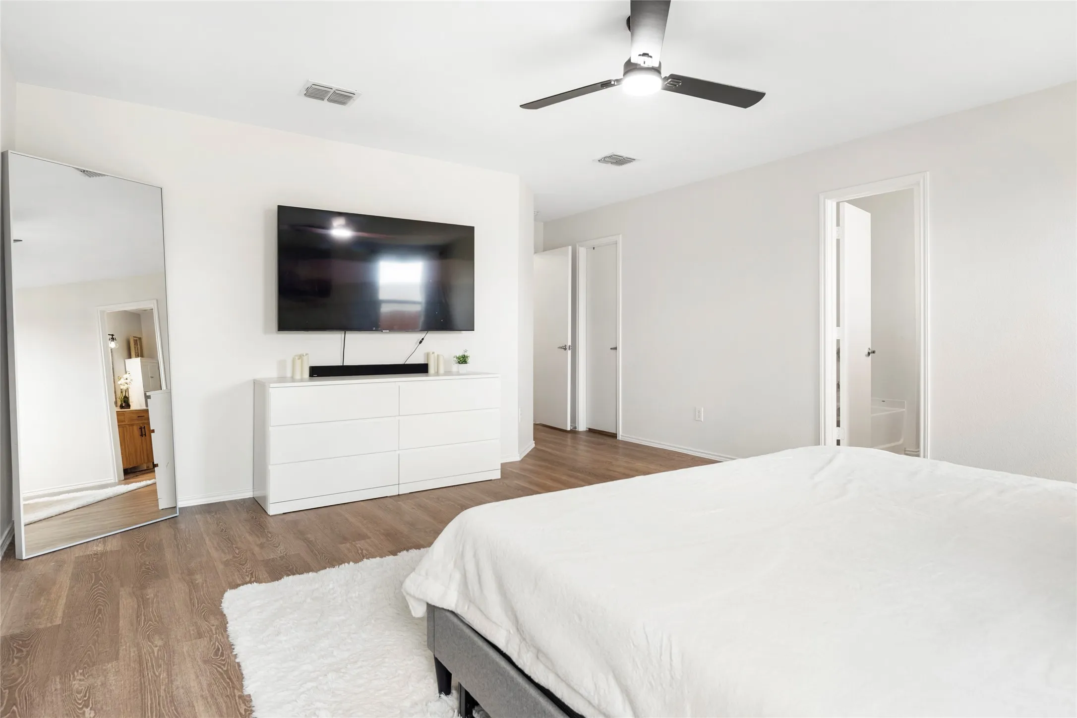 Large primary bedroom. The TV stays!!