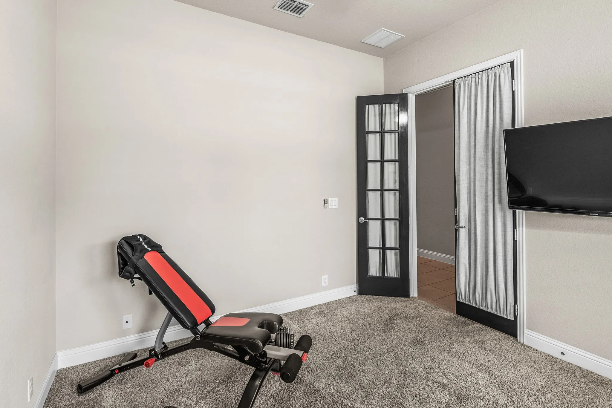 Office currently used for exercise equipment