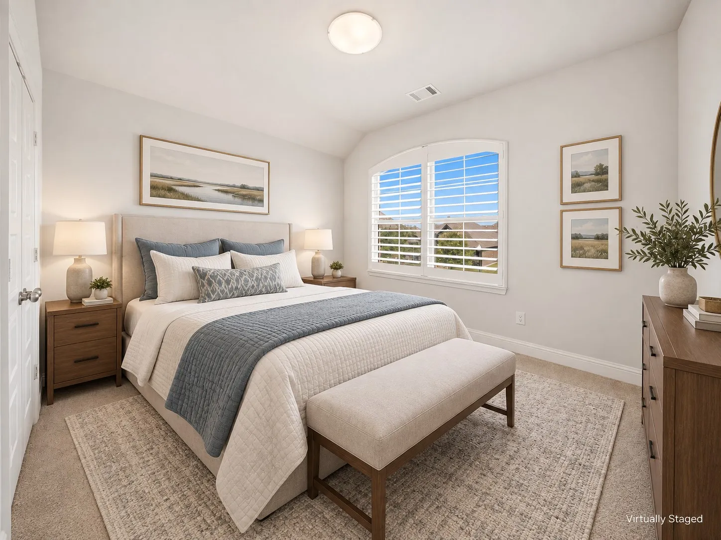 Upstairs Bedroom featuring a vaulted ceiling with a ceiling fan, recessed lighting, an arched window with plantation shutters, and black iron baluster railing