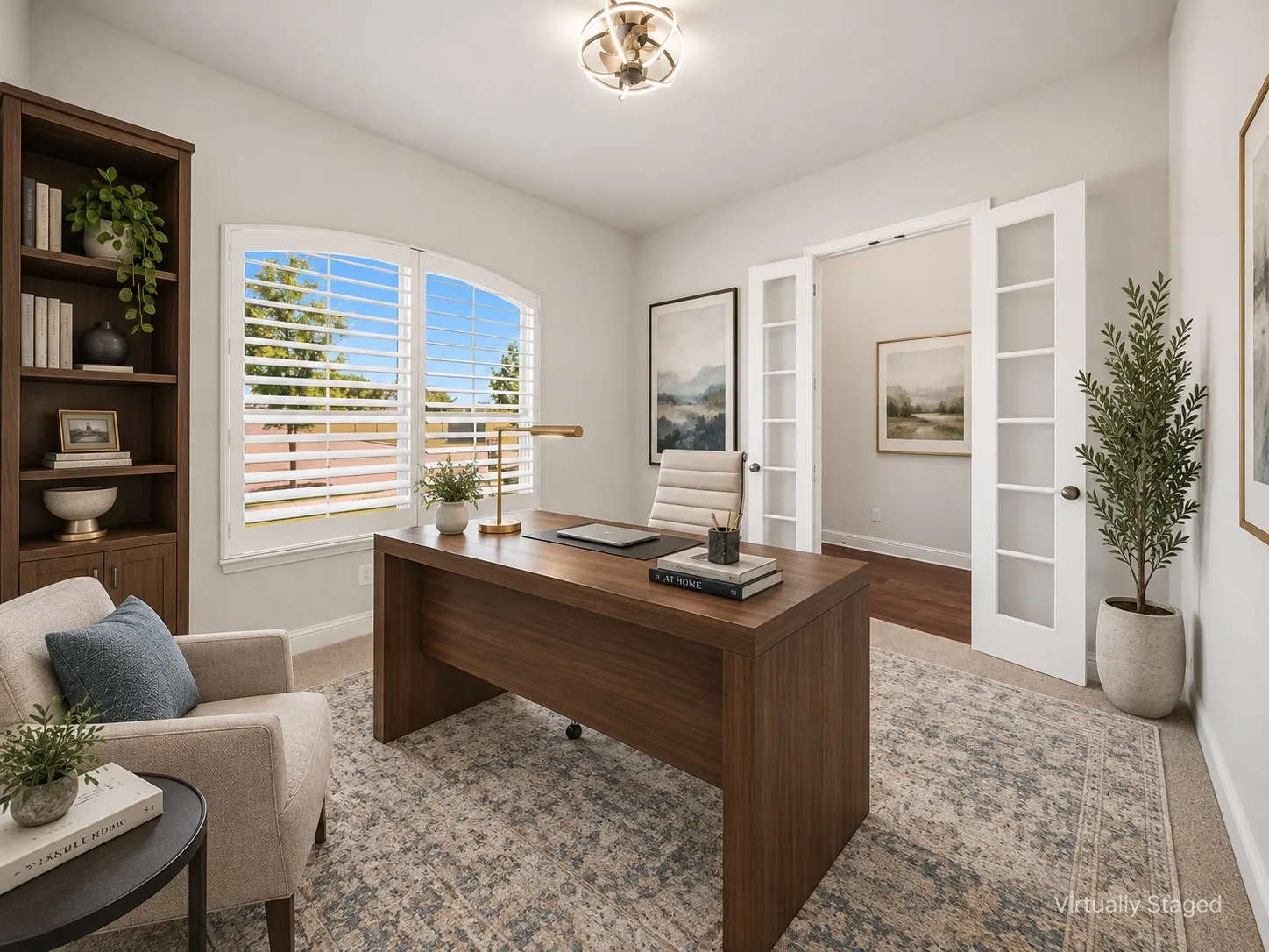 Office featuring an arched window with plantation shutters, carpet flooring, and a contemporary ceiling light fixture