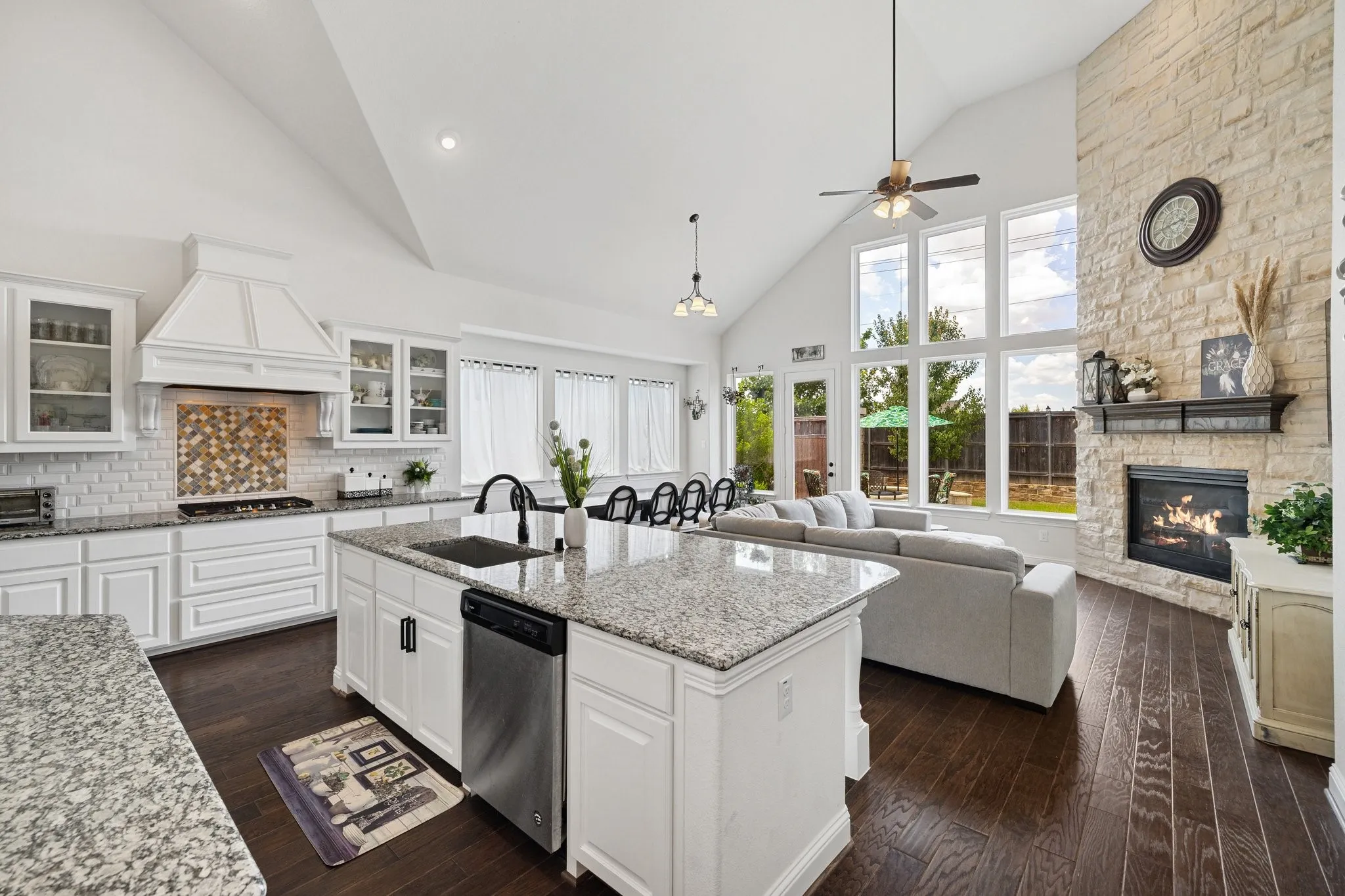 Open-concept living space with dark wood-finish flooring