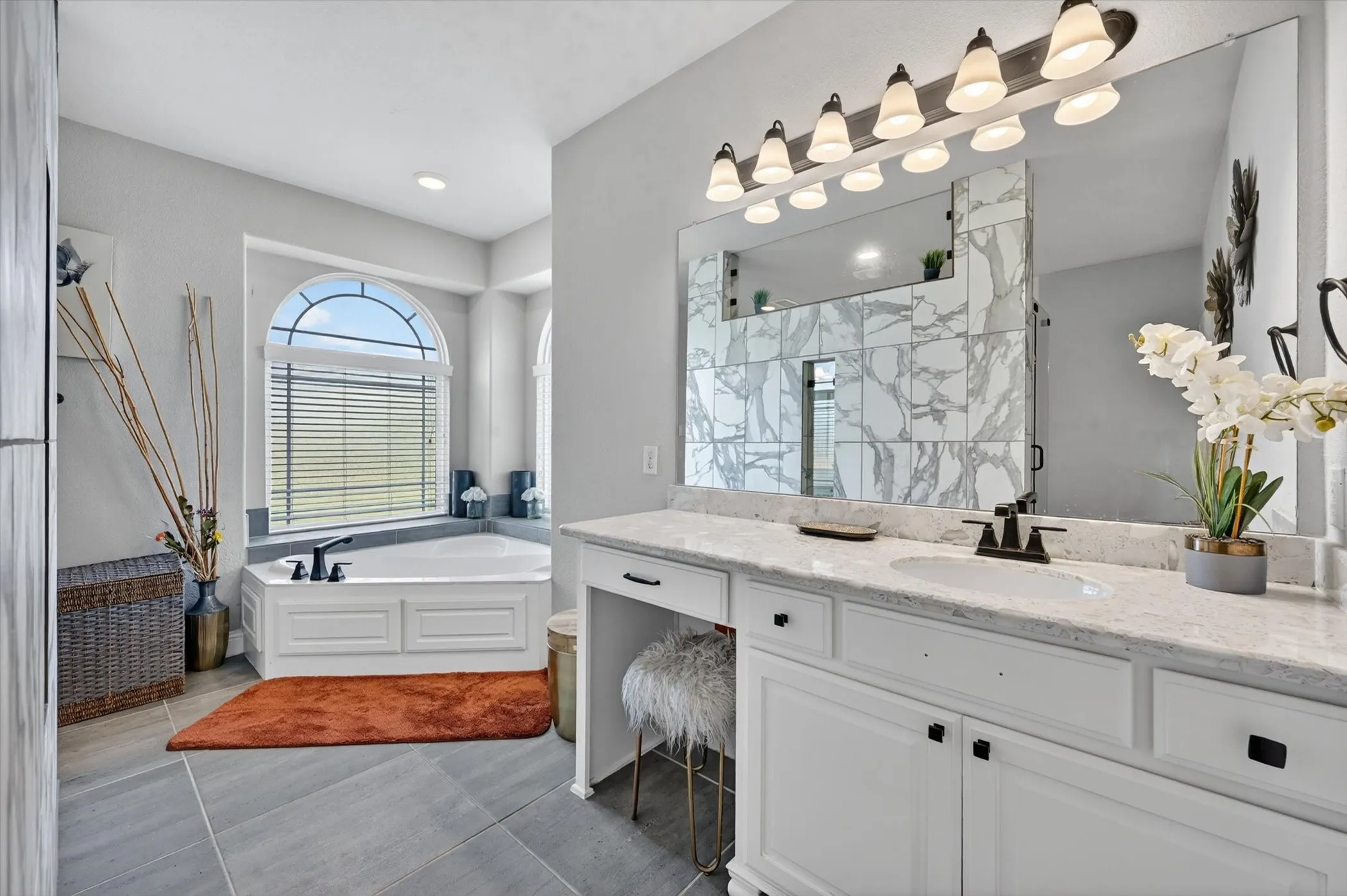 Primary Bath Spacious bathroom featuring a white vanity with granite-style countertop and integrated sink