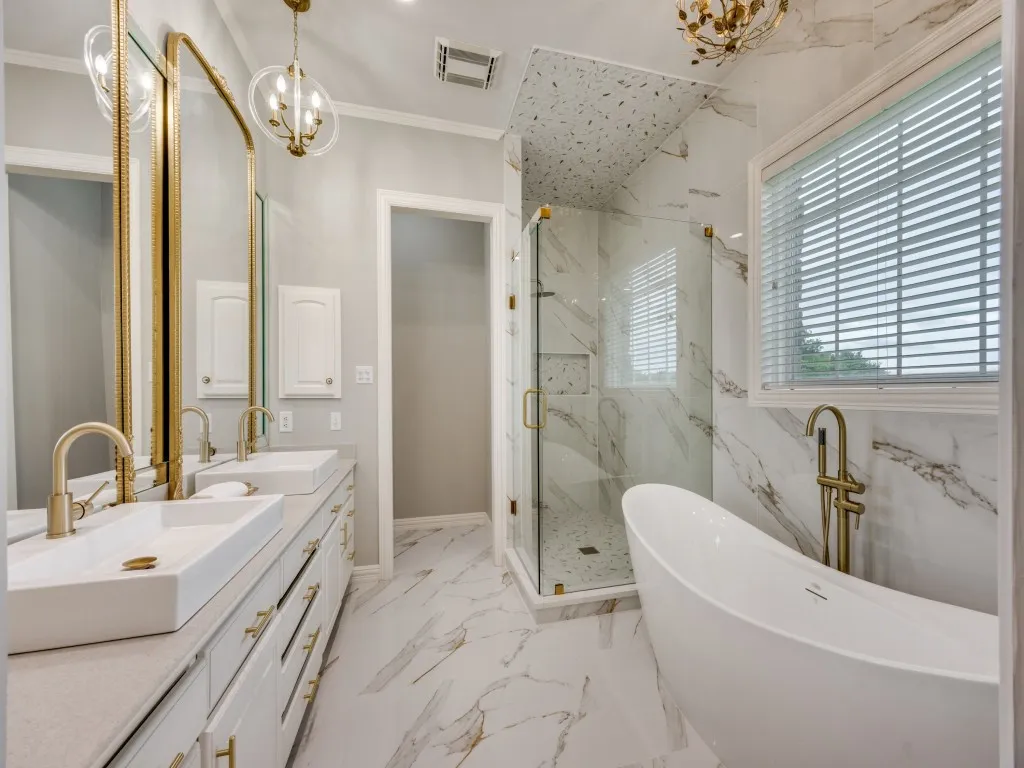 Dual vanity with vessel sinks and gold-finish fixtures