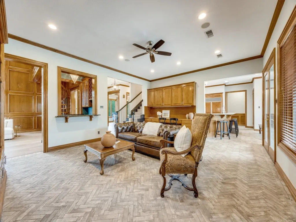 Herringbone-patterned wood-finish flooring throughout