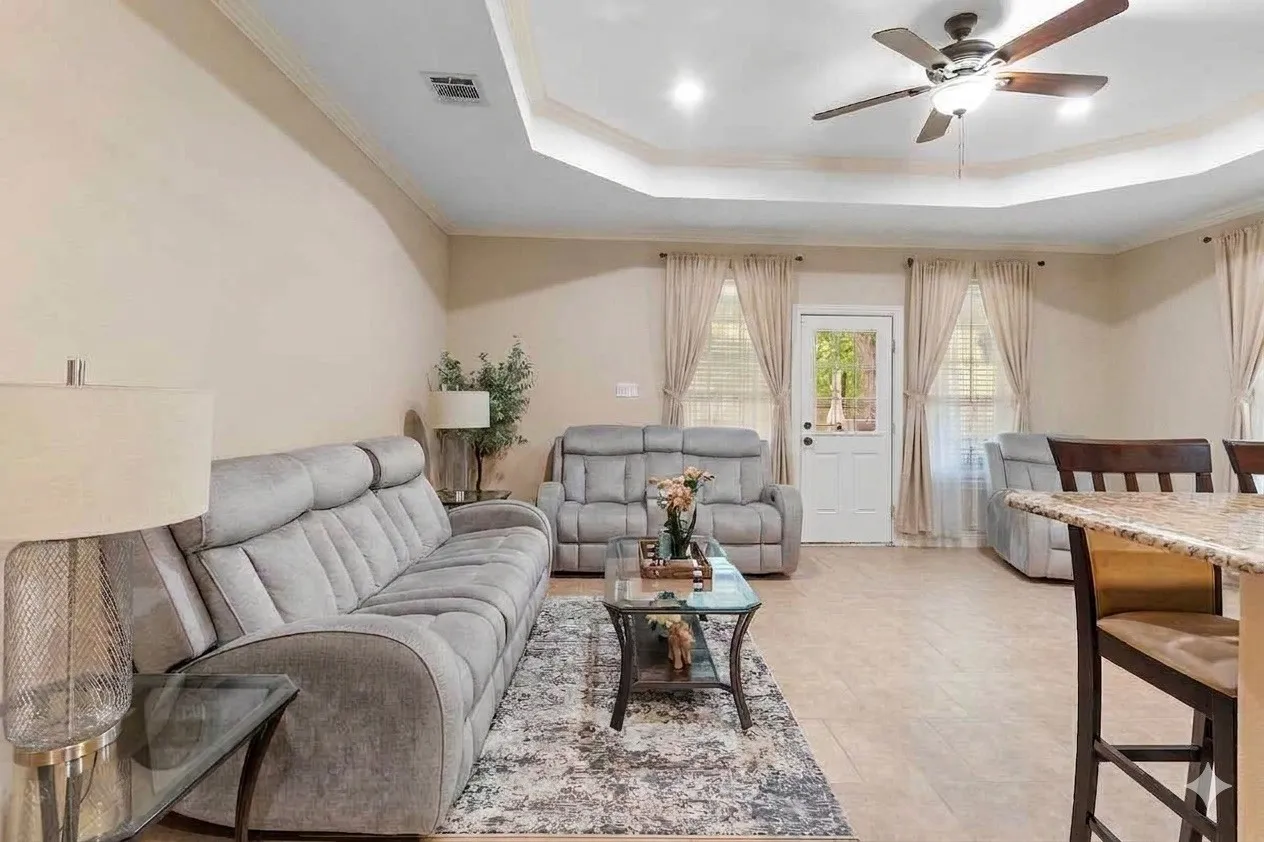 Tray ceiling with recessed lighting and crown molding
