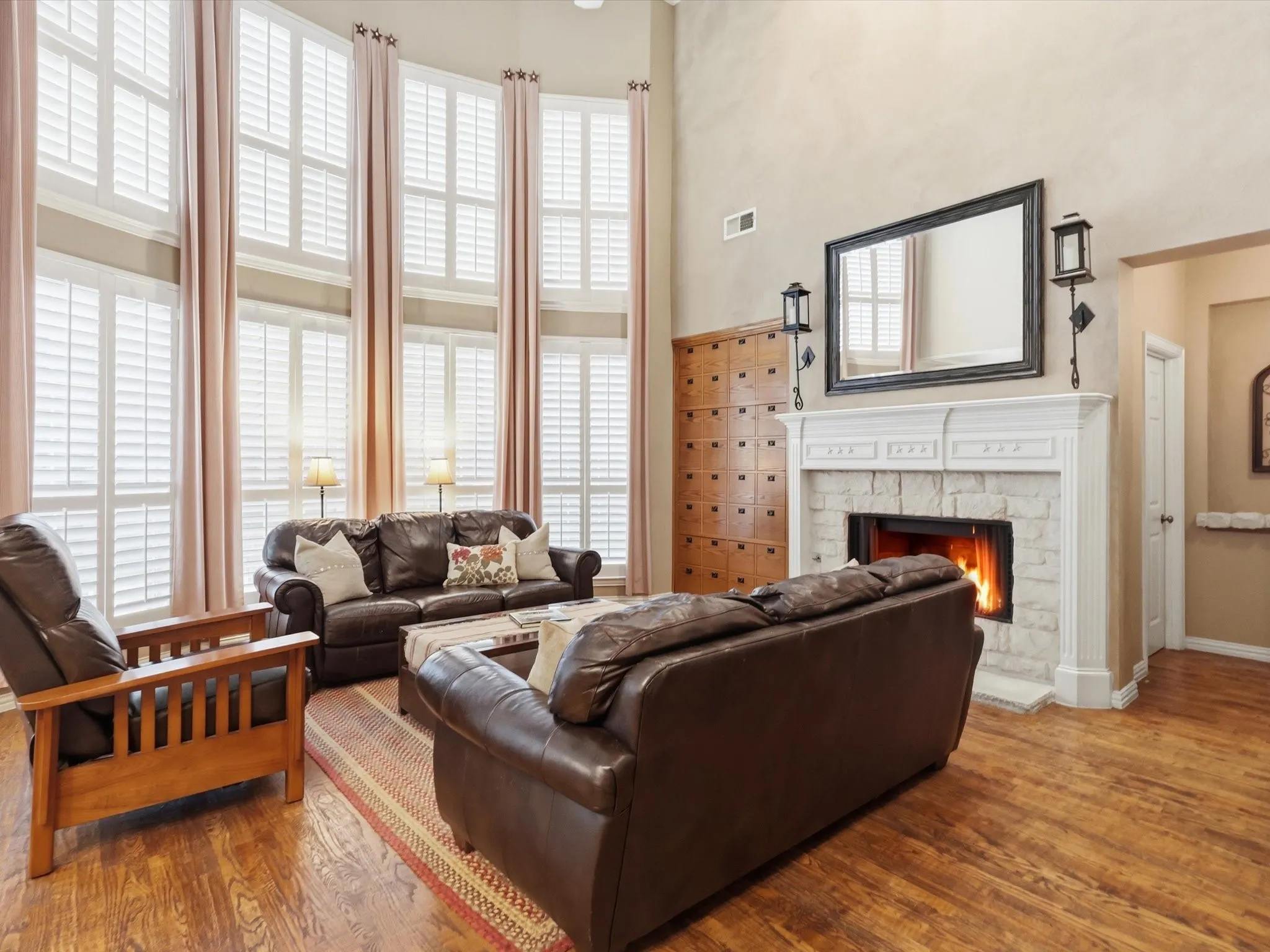 18 foot ceilings and stacked windows with plantation shutters that overlook your lush backyard.