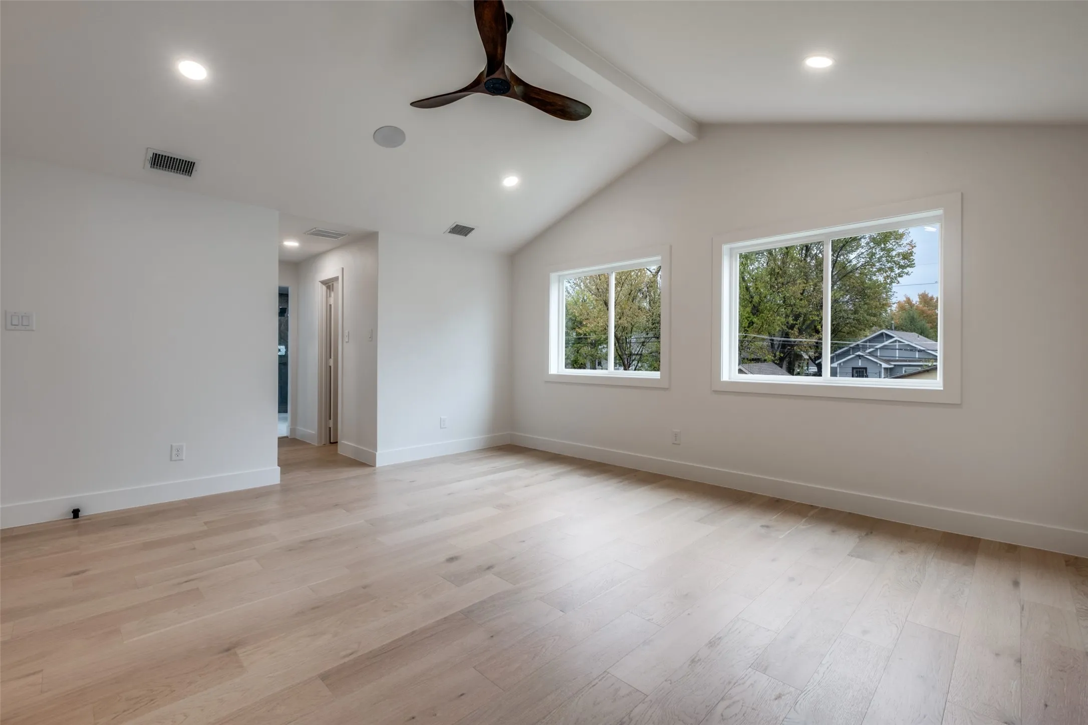 Two separate walk-in closets and vaulted ceiling