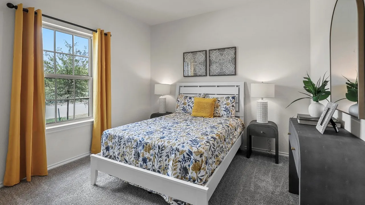 Carpeted room featuring a double-hung window, white walls, and a white paneled headboard