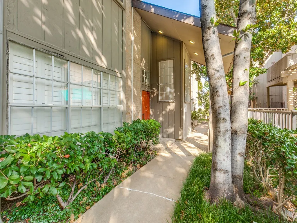 Property entrance featuring board and batten siding