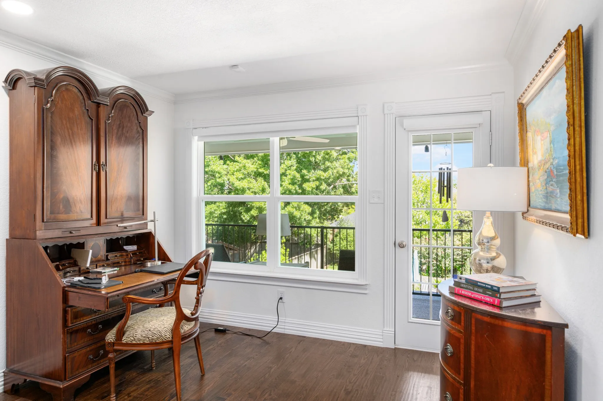 A covered balcony provides a relaxing area to enjoy the views of the backyard and pool. Off the balcony is a walk-in storage closet.