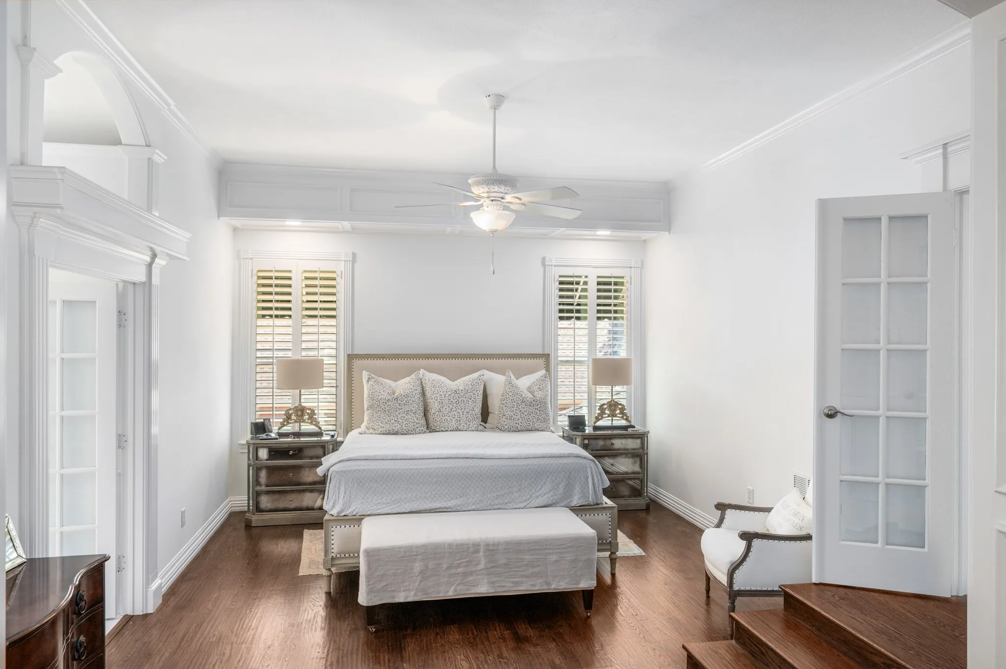 Intricate woodwork is seen in the baseboards, crown molding and trim on the doorways.