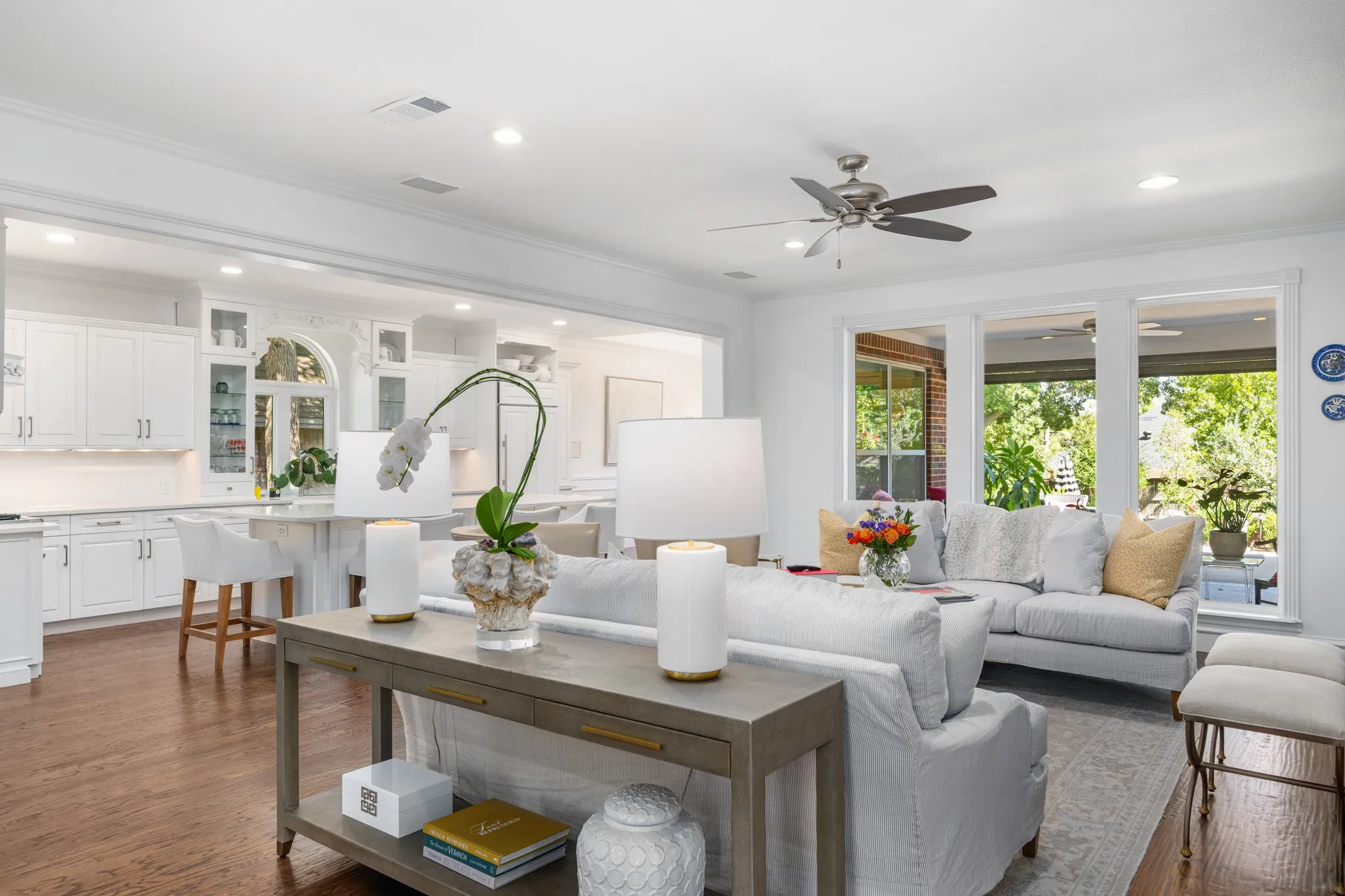 An open floor plan allows viewing of the lushly landscaped backyard.