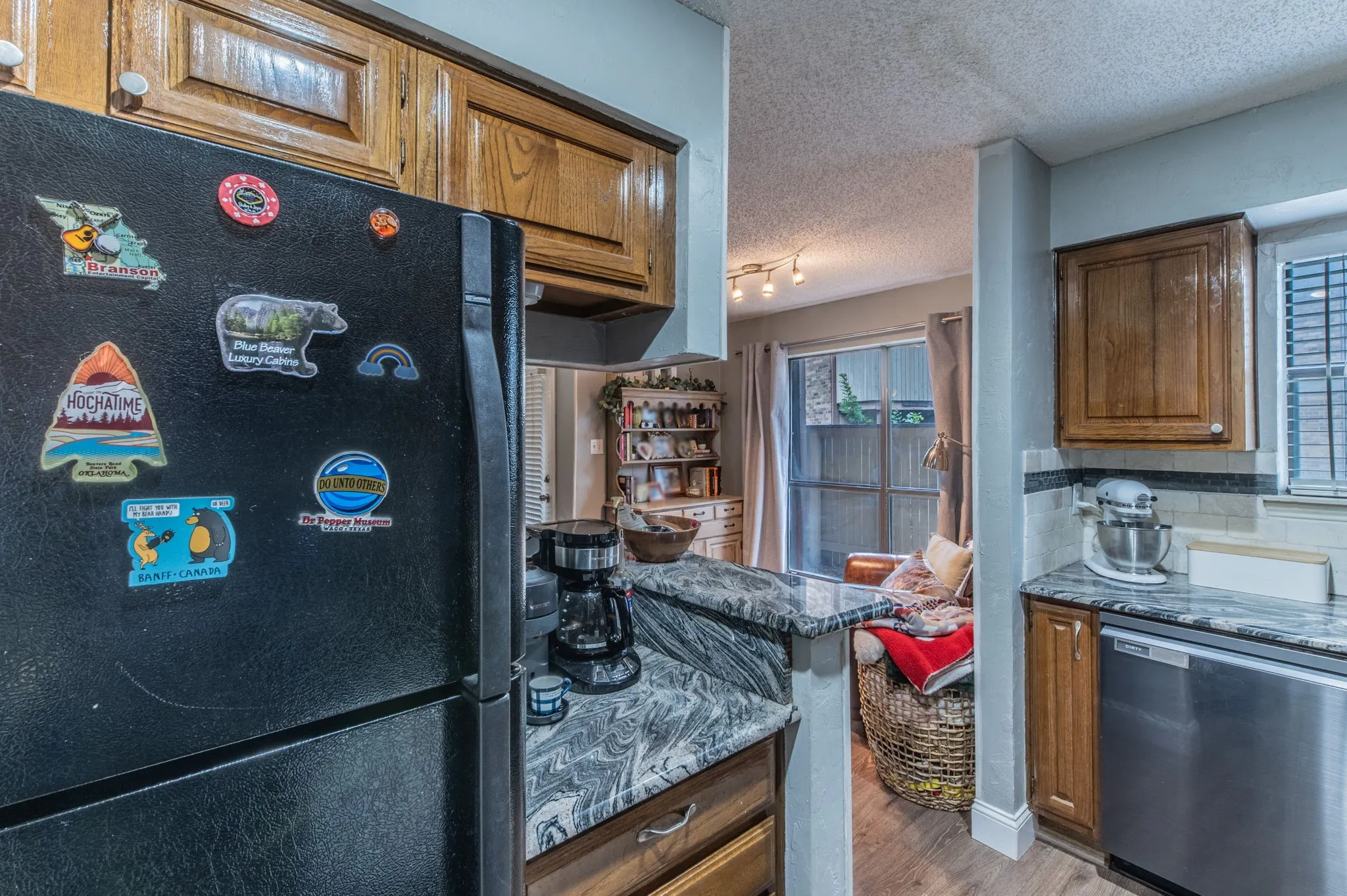 Kitchen is open to the breakfast nook-sitting room.