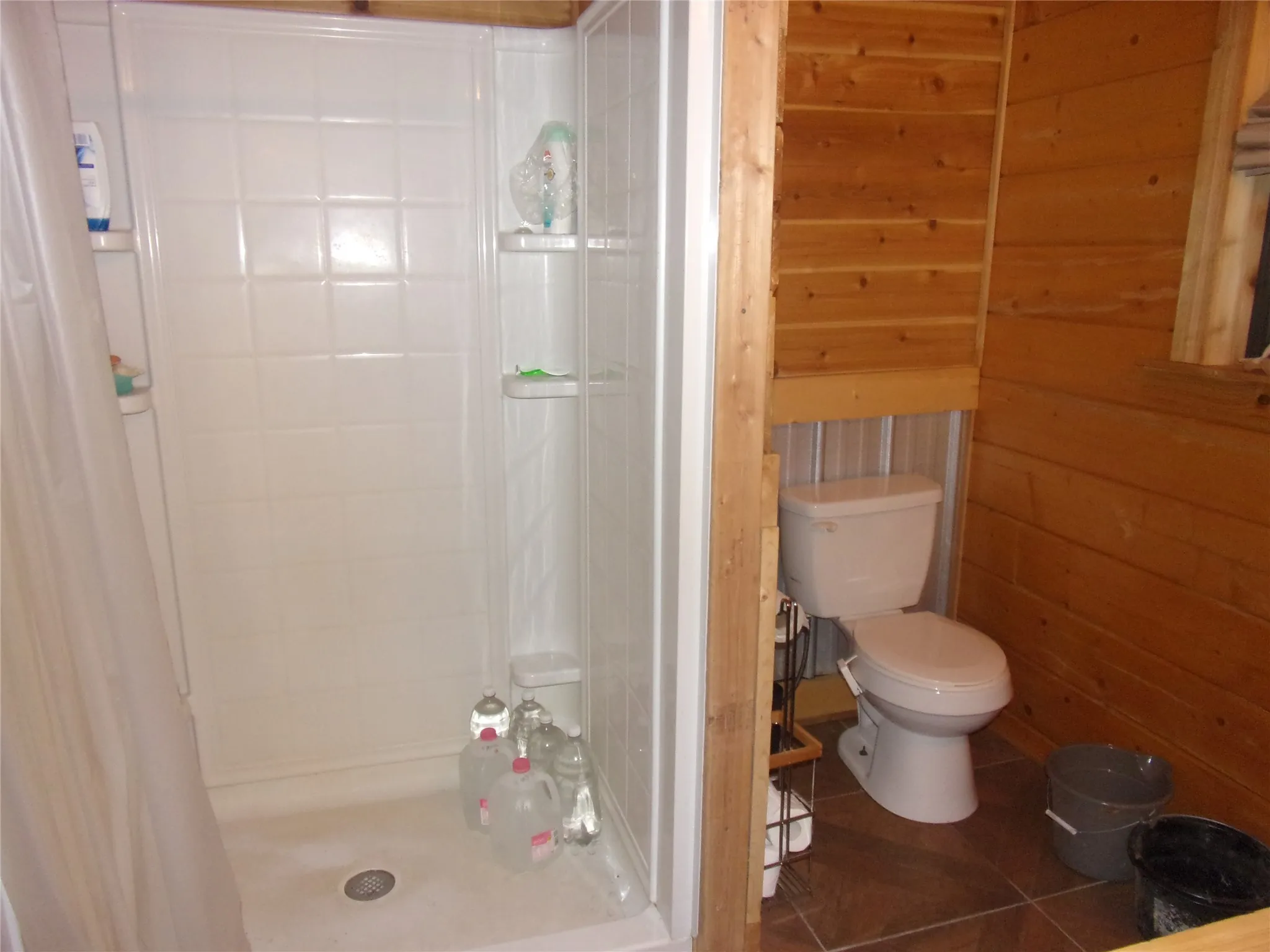 shower and toilet in master