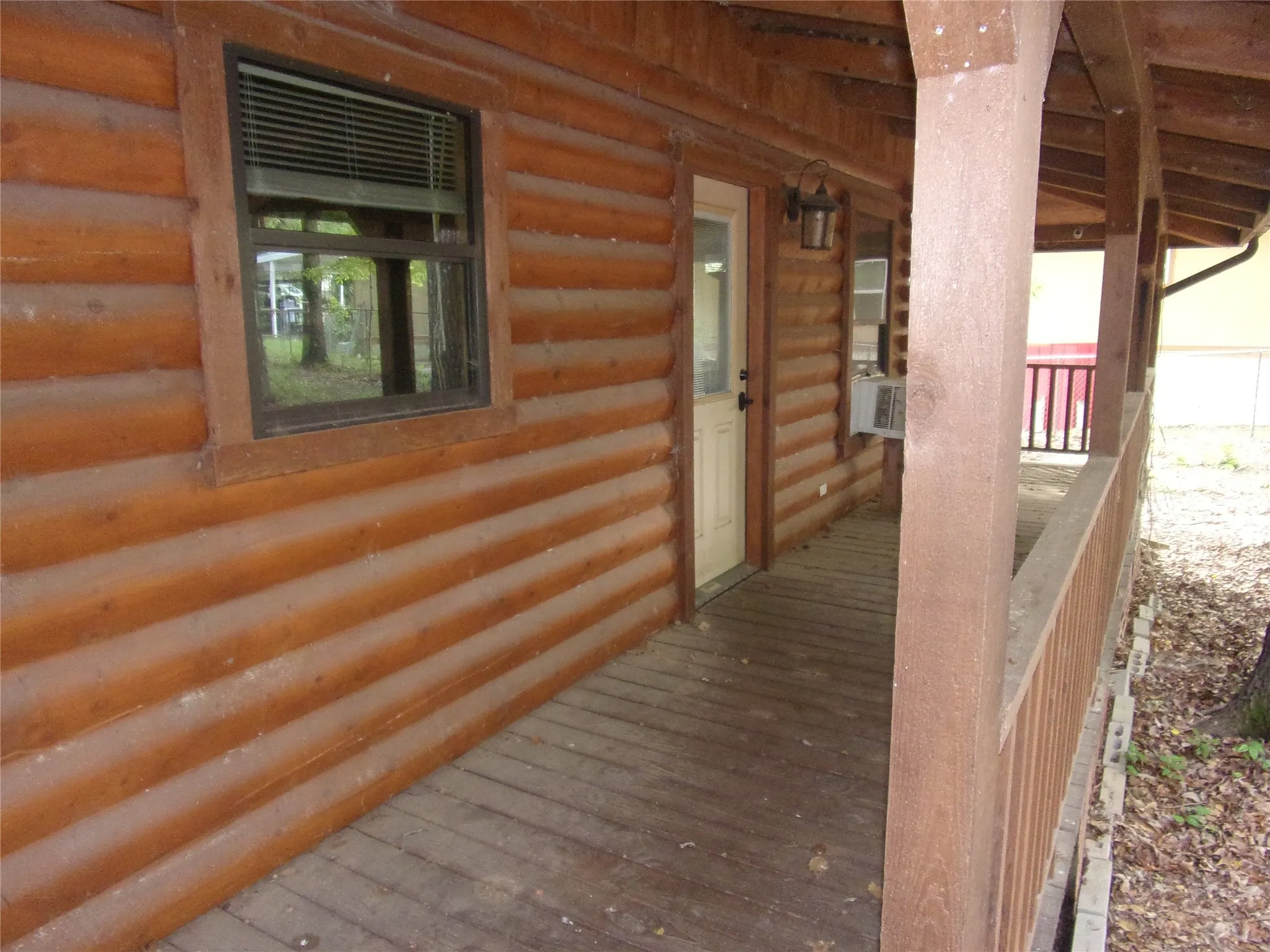 front porch entry into log home
