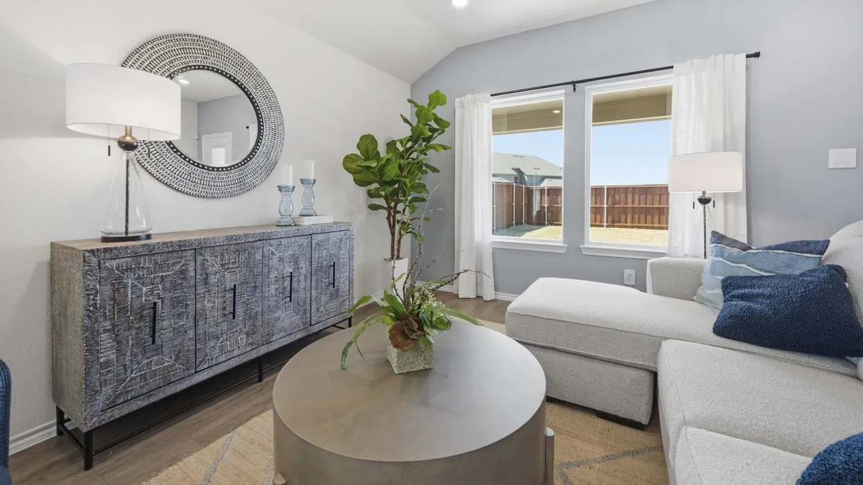 Open-concept room featuring light wood-finish flooring, recessed lighting, and expansive windows
