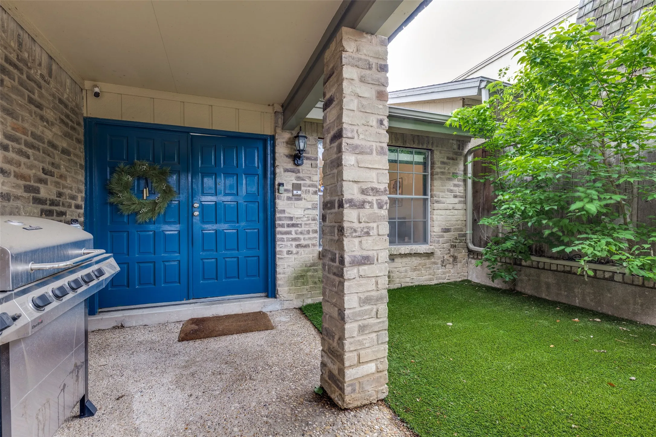 Private front courtyard that is fully turfed