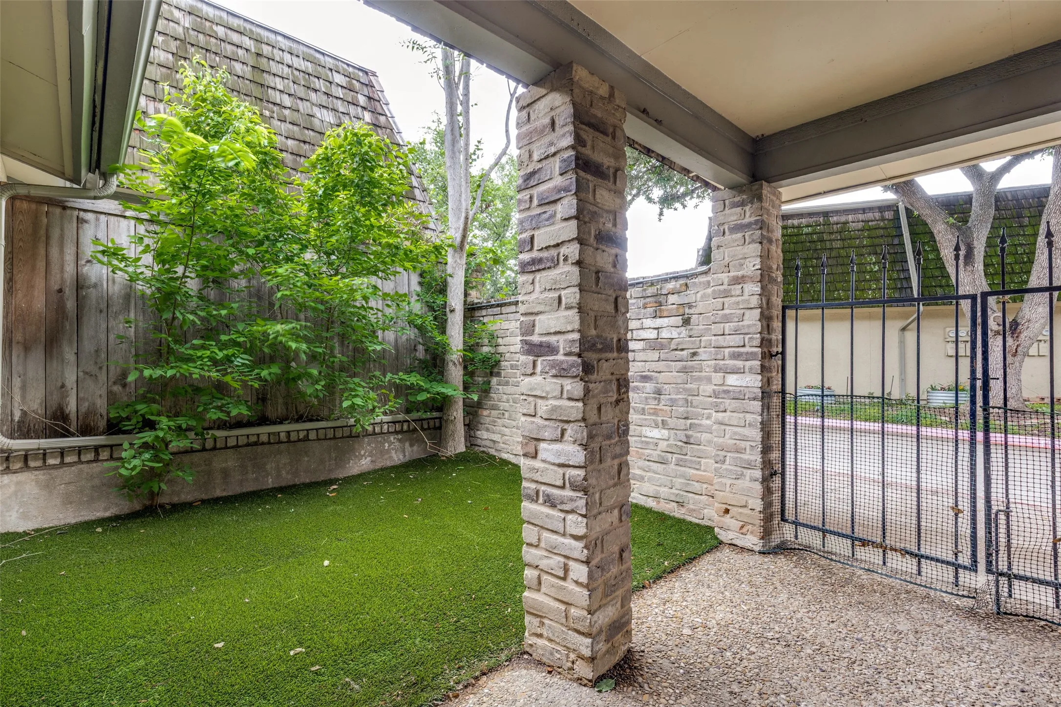 Private front courtyard that is fully turfed