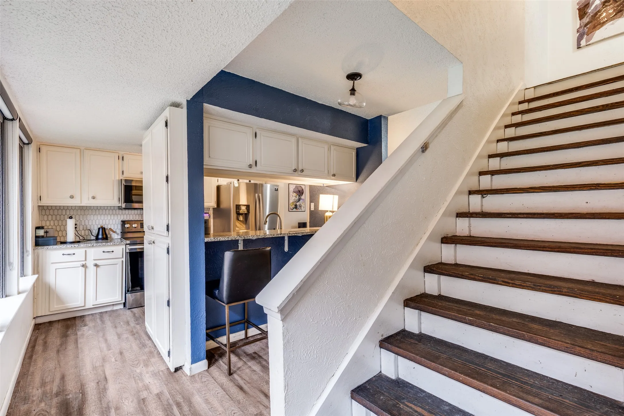 Open kitchen with bar seating