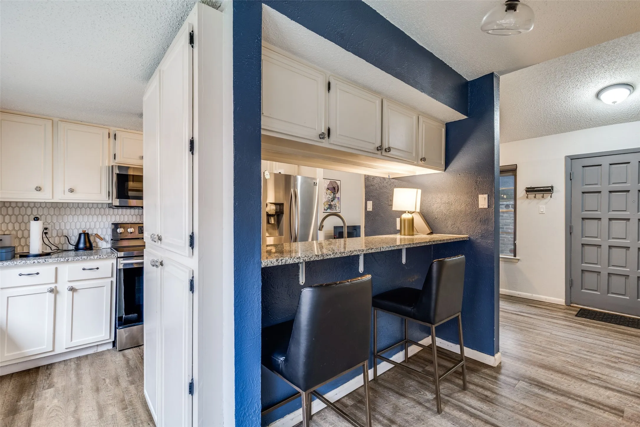 Open kitchen with bar seating
