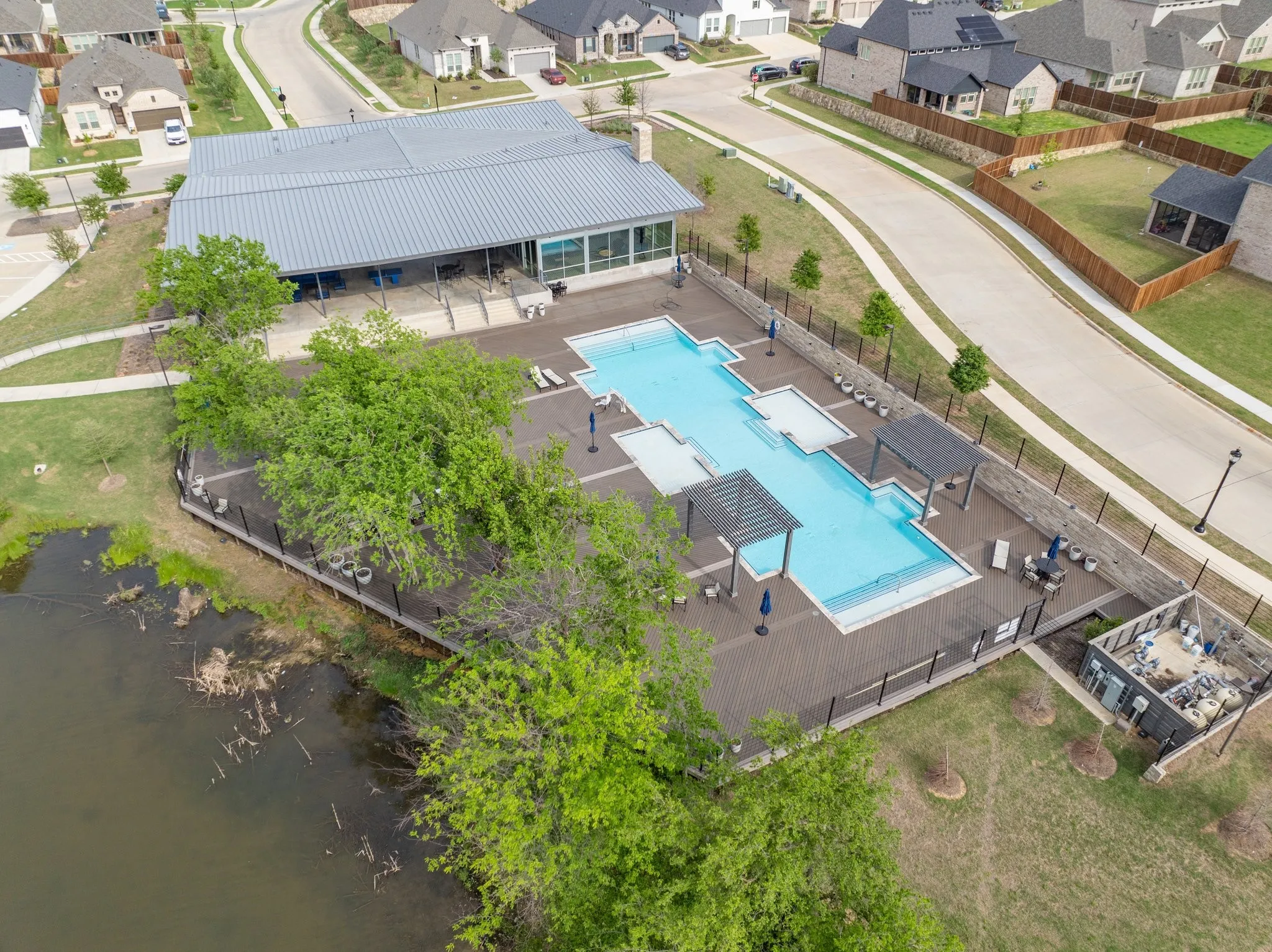 Resort Style Community Pool along with Fishing Pond
