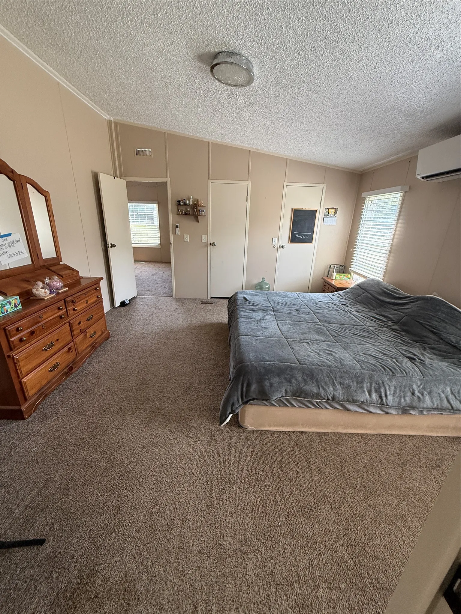 Primary bedroom with walk in closets, adjoining primary bathroom and office/living area. Additional HVAC in this room.