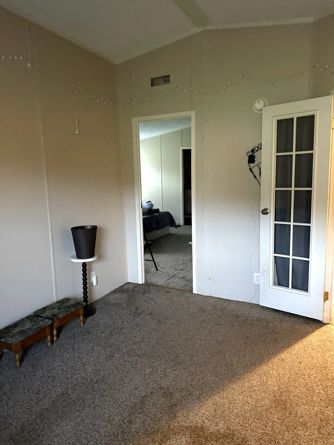 Office or living area adjoining primary bedroom and kitchen