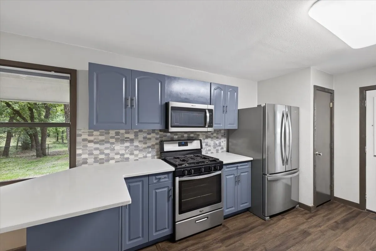 Stainless appliances with gas stove, dishwasher and microwave