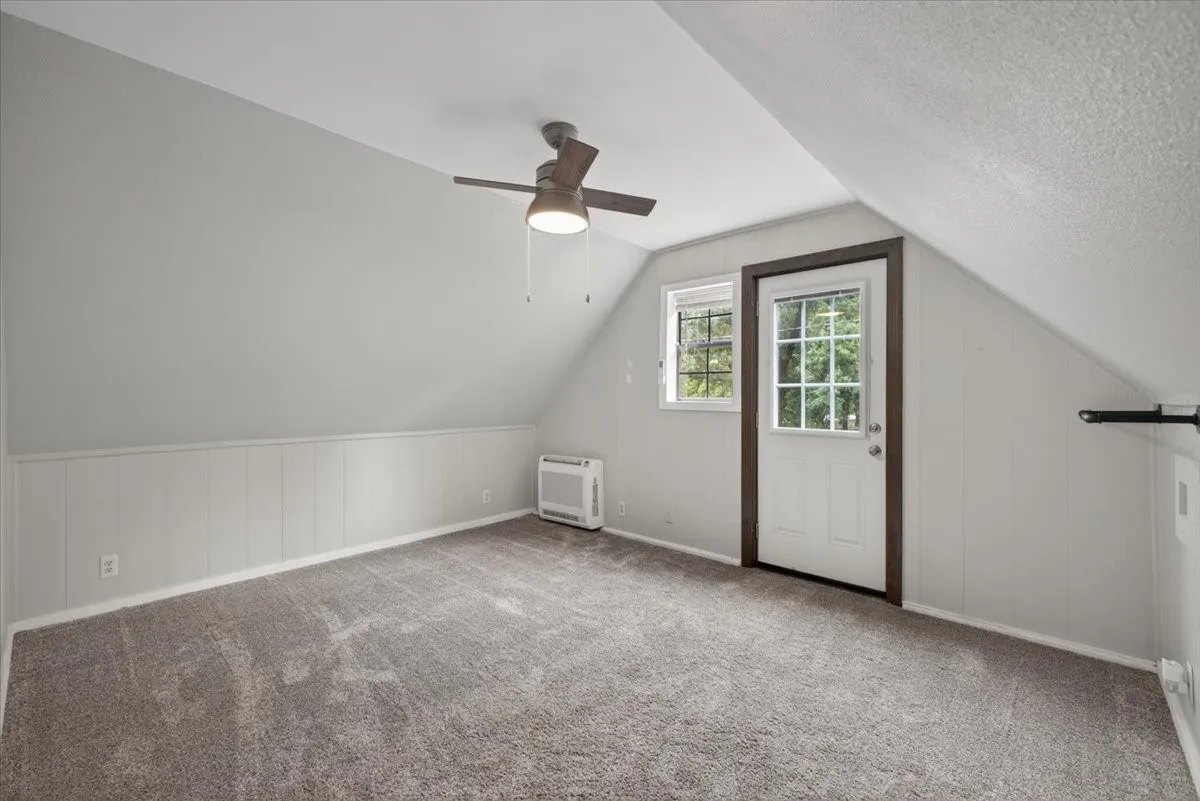 Upstairs bedroom with door to balcony