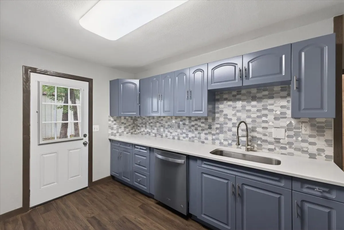 Another view of kitchen showing back door access
